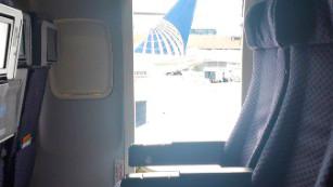 The couple opens the emergency door and leaves the moving plane in New York